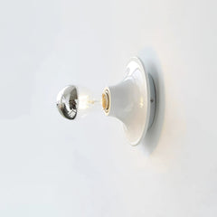White disc wall sconce fitted with a mirror crown electroplated bulb