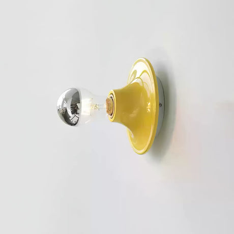 Yellow disc wall sconce with a mirror crown electroplated bulb, side view
