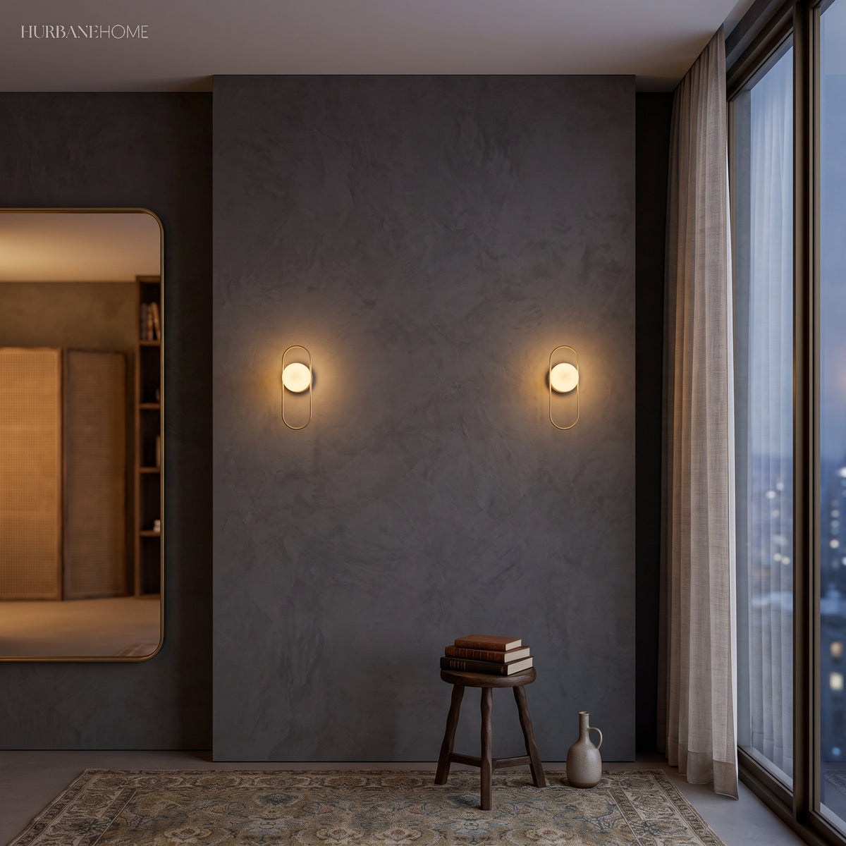 Pair of globe sconces on a dark plaster bedroom wall beside a mirror