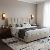 Modern glass globe wall light shown unlit against pale wall