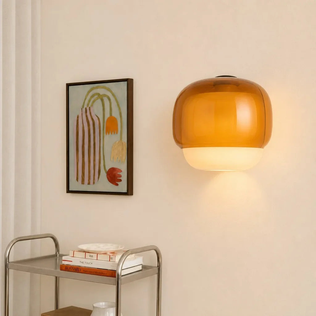Modern glass wall sconce side profile against a neutral backdrop