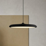 Underside of the disc pendant light showing the wide even glowing diffuser
