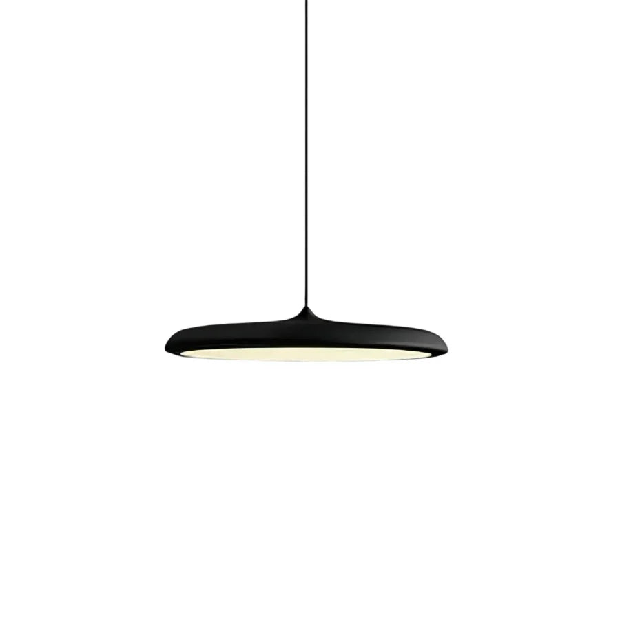 Green disc pendant light lit from below showing the wide diffuser