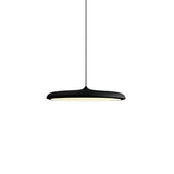 Green disc pendant light lit from below showing the wide diffuser