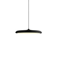 Green disc pendant light lit from below showing the wide diffuser