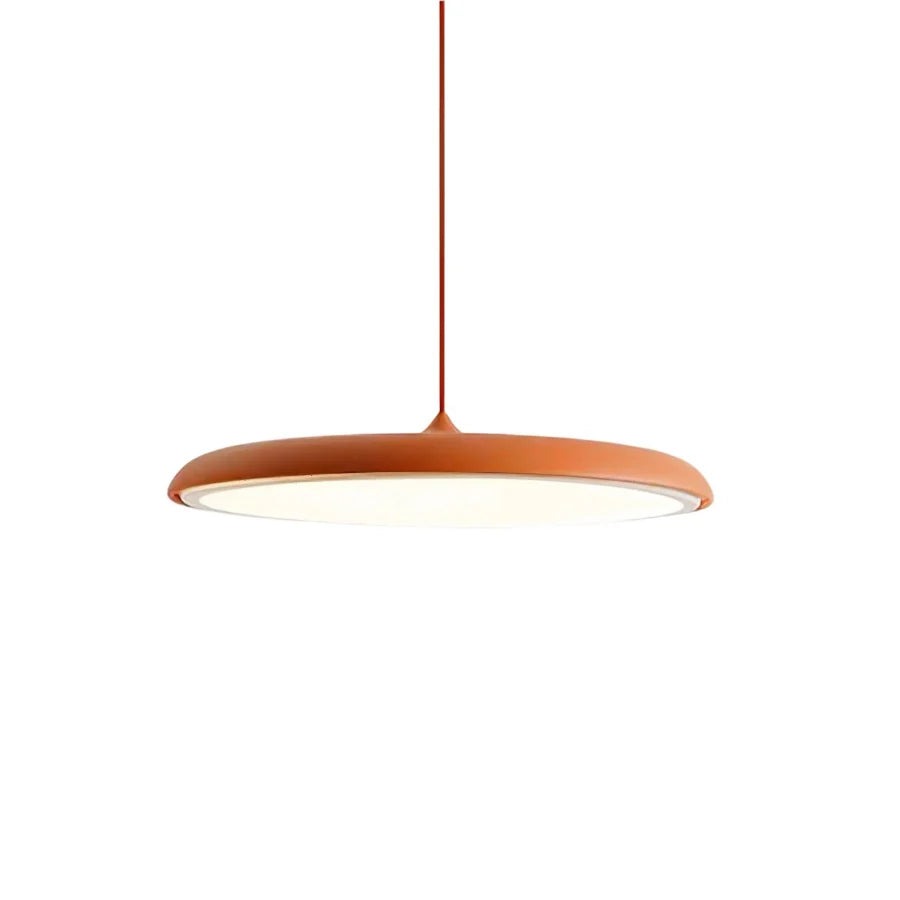 Orange disc pendant light detail showing the rounded rim and frosted diffuser