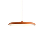 Orange disc pendant light detail showing the rounded rim and frosted diffuser
