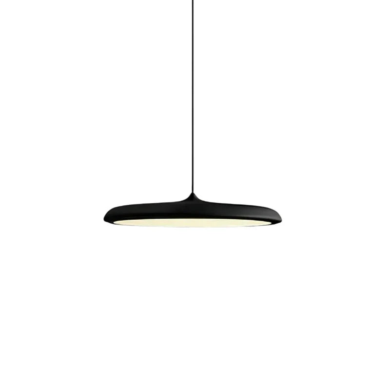 Pink disc pendant light close up highlighting the smooth painted metal shade