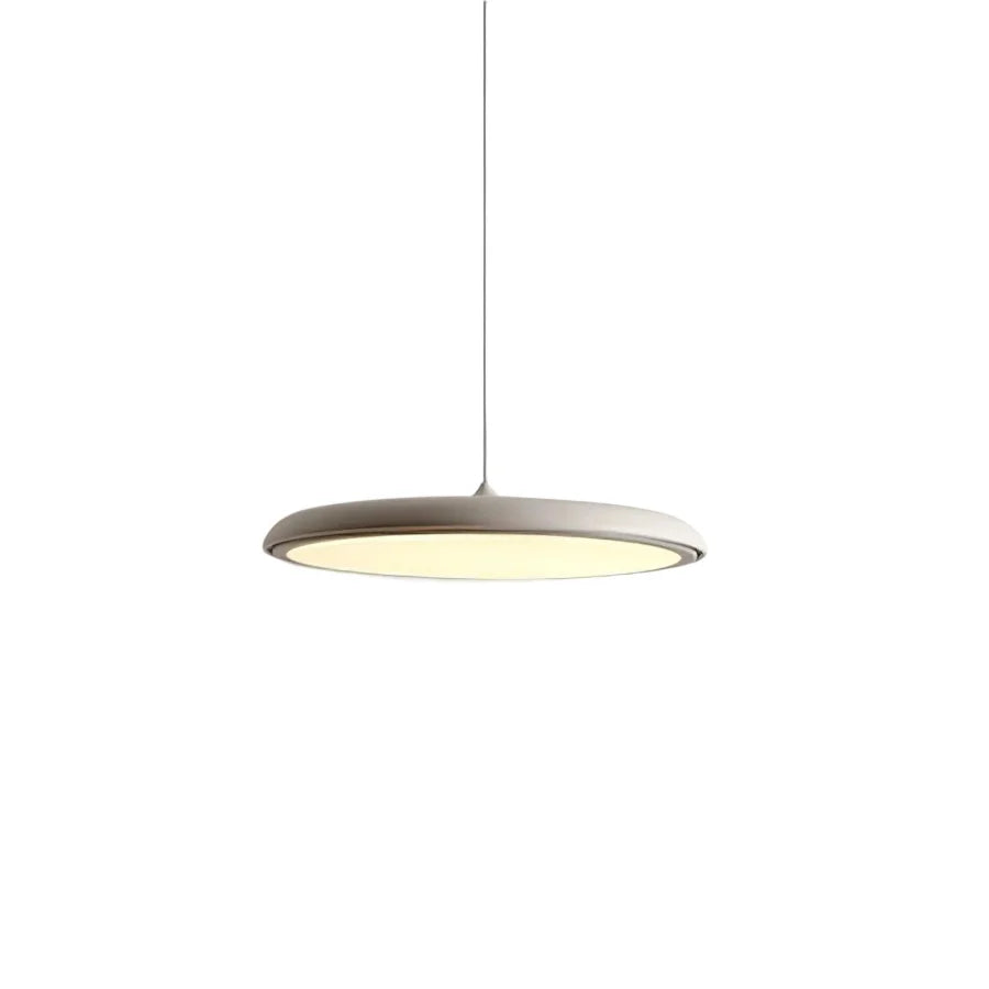 White disc pendant light photographed straight on against a plain background