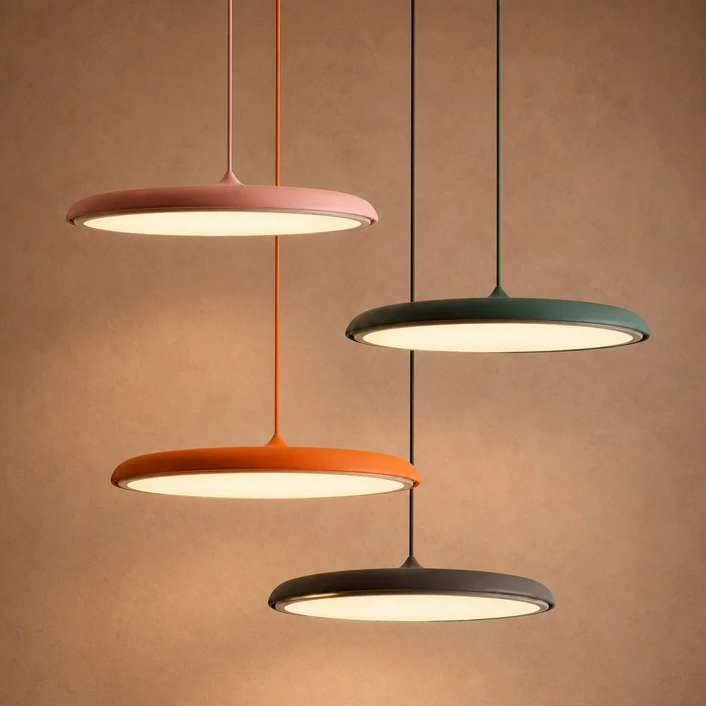 White LED disc pendant lit from below with a soft even glow