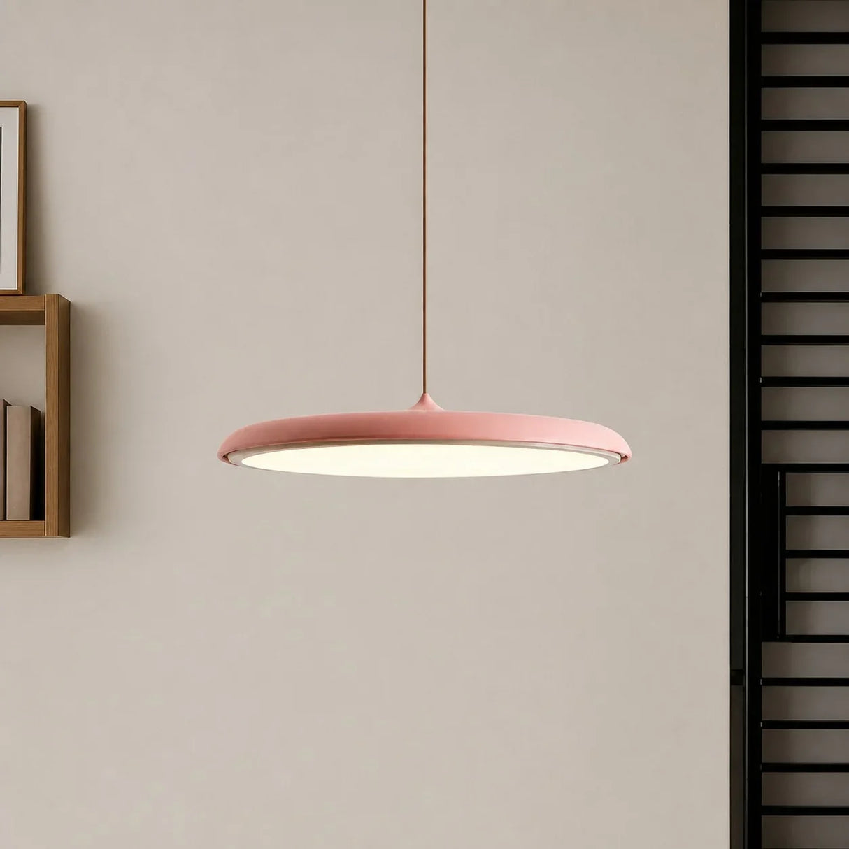 White disc pendant light seen from the side showing its slim flat profile