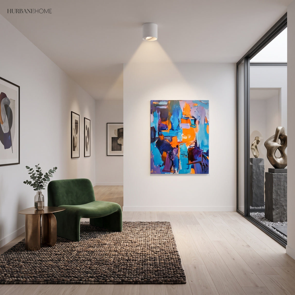 White ceiling spotlight in a bright room with green armchair and rug