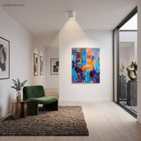 White ceiling spotlight in a bright room with green armchair and rug