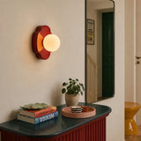 Beige flower-shaped orb wall sconce with soft warm glass globe light