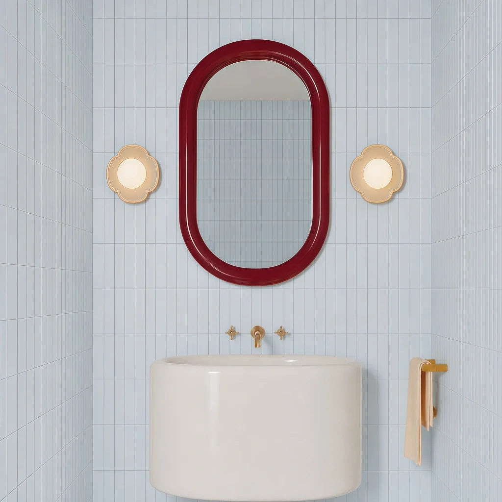 Side angle of the orb wall sconce showing the domed glass globe shade
