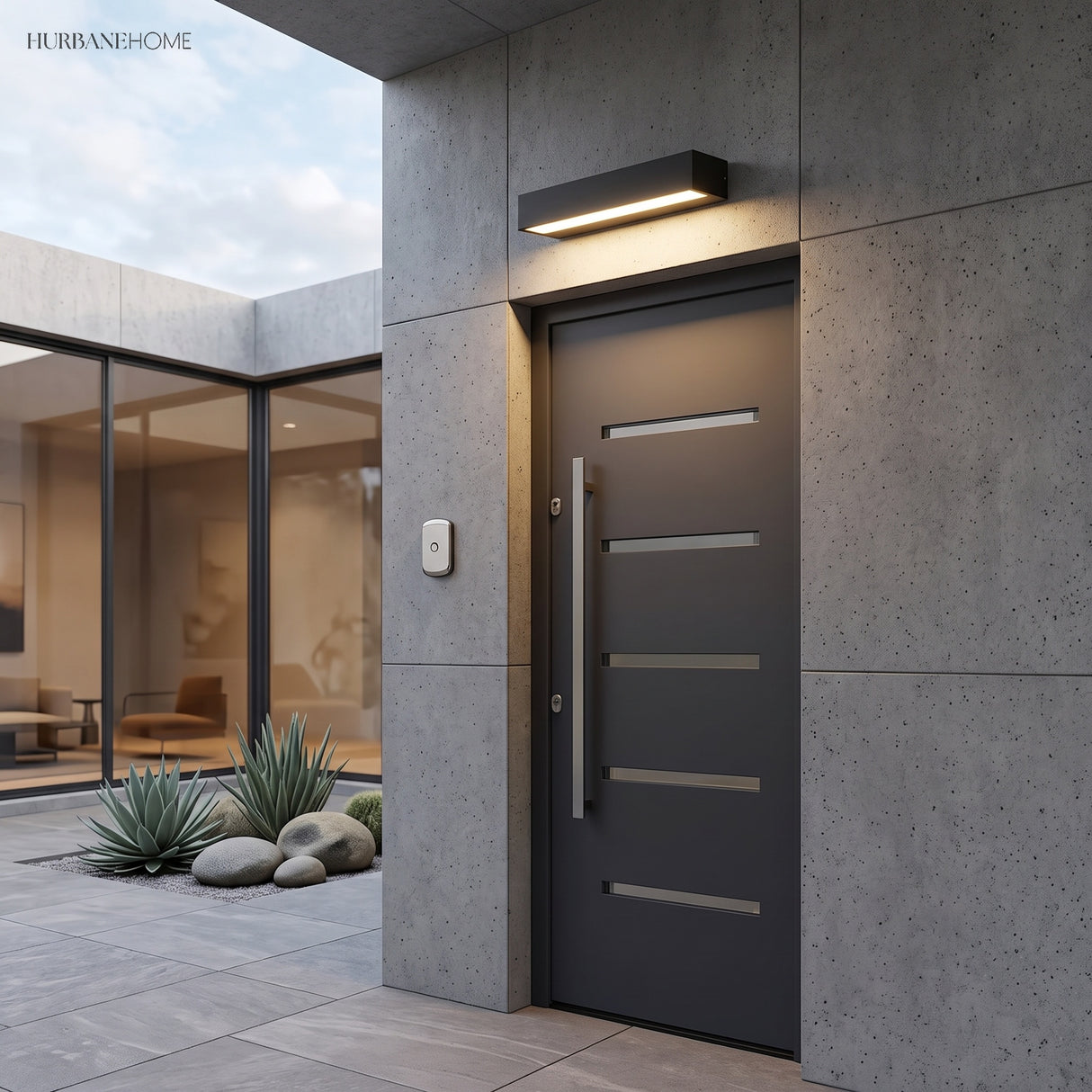 Long bar sconce lighting a covered patio seating area at dusk