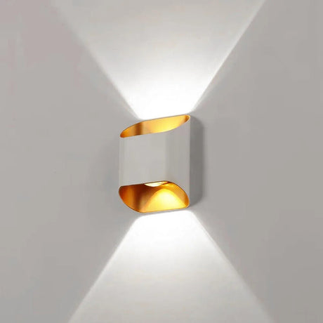 White up down wall sconce lit on a pale wall showing two beams
