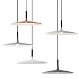 Four saucer pendants in mixed colors hung together on white