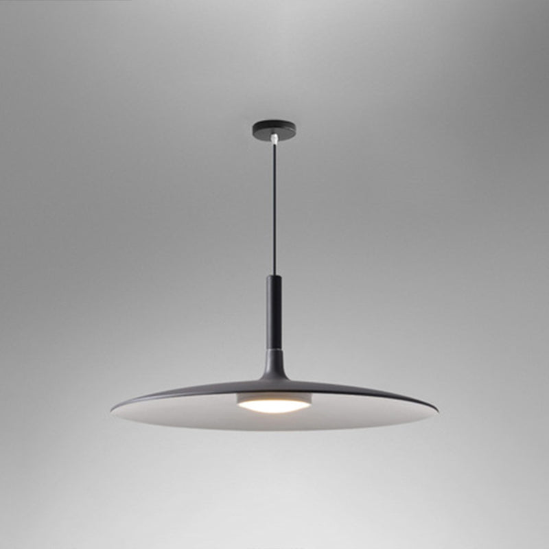Grey saucer pendant shade shown from a low angle on grey