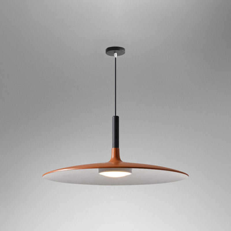 Orange saucer pendant shade seen from below on a grey background