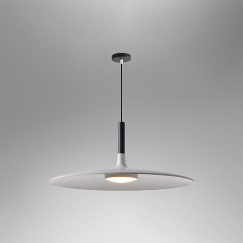 White saucer pendant shade shown at an angle on grey