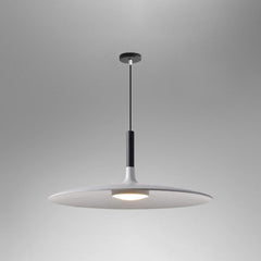 White saucer pendant shade shown lit on a grey background