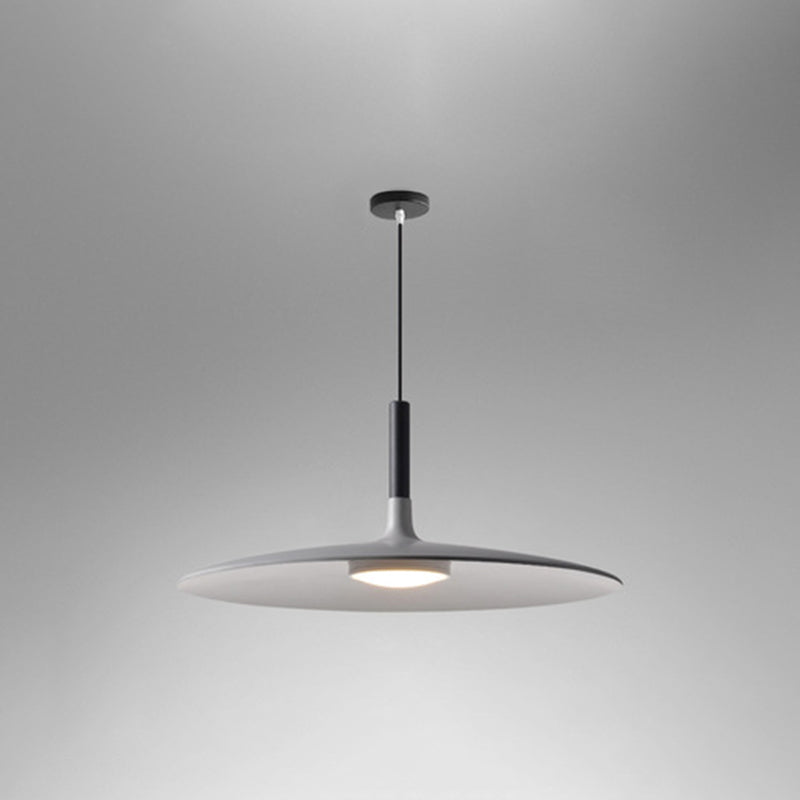 White saucer pendant shade seen from below on a grey background