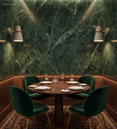 White cone sconces mounted on a green marble restaurant wall