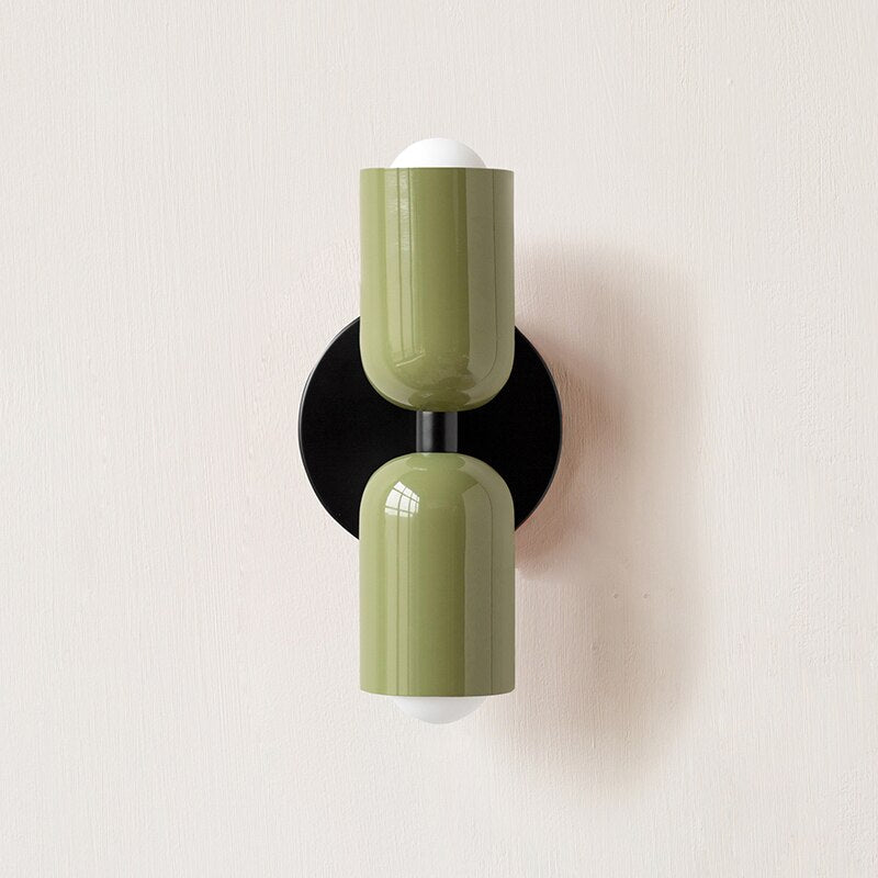 Cream and olive cylinders shown on a black backplate