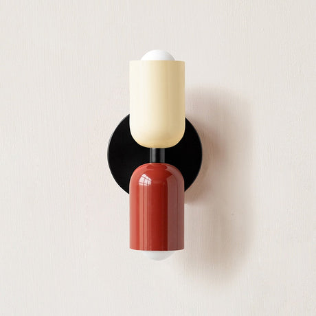 Cream and dark red cylinders on a black round backplate