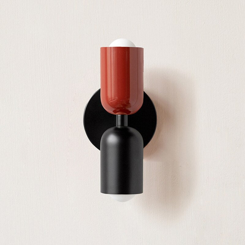 Dark red and black cylinders on a black round backplate