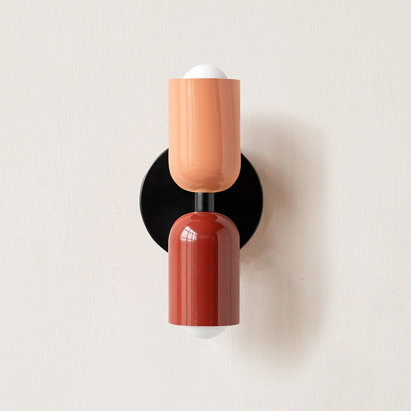 Terracotta and dark red cylinders shown on a black backplate