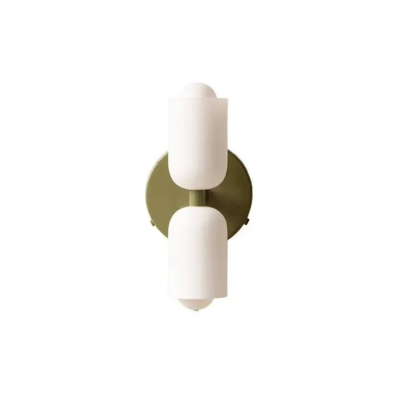 White cylinders on a brushed gold backplate without a cord