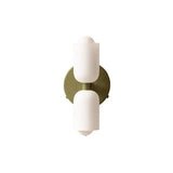 White cylinders on a brushed gold backplate without a cord