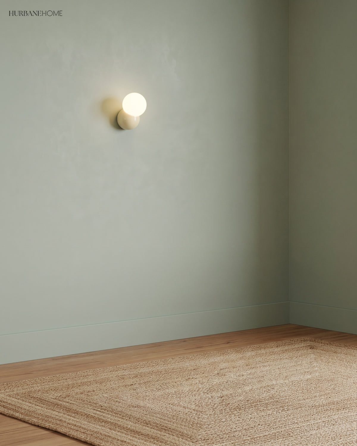 Single wall sconce mounted high on a plain sage green wall above a jute rug