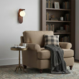 Modern wall sconce side profile showing slim wood backplate