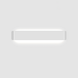 White linear wall sconce photographed alone on a grey ground