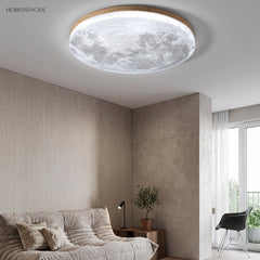 Cool white moon ceiling light over a minimalist living room with a sofa