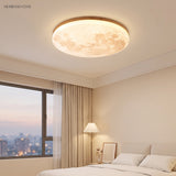 Moon round flush mount ceiling light styled in a calm modern interior