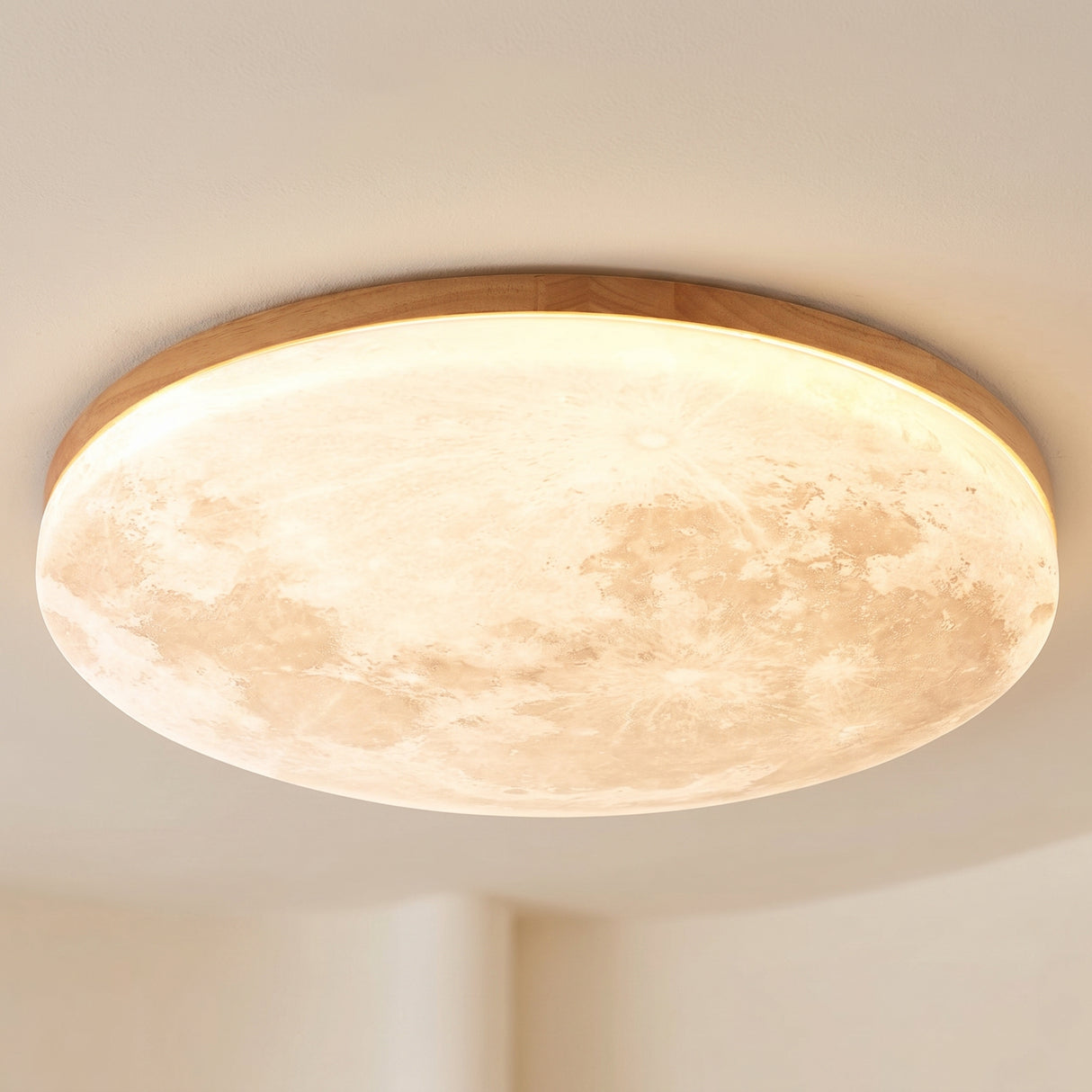 Moon design round LED flush mount ceiling light, studio product photo