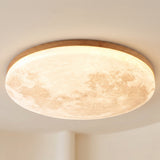 Moon design round LED flush mount ceiling light, studio product photo