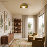 Olive disc ceiling light in a plant-filled room