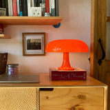 Mushroom table lamp with a domed shade and pedestal base, product view
