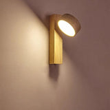 Natural wood travertine wall sconce mounted on a plain neutral wall
