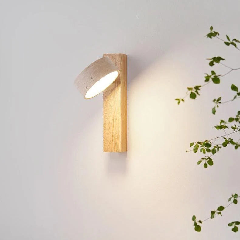 Close view of the natural wood sconce with its travertine shade rotated
