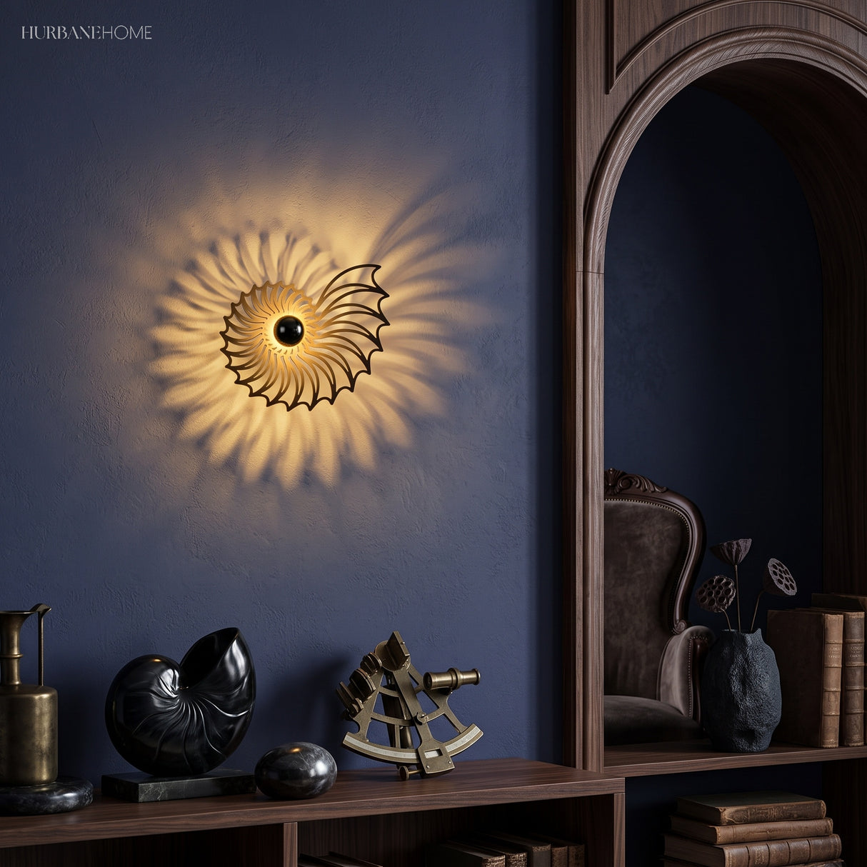 Nautilus shell wall light glowing on a blue-grey wall