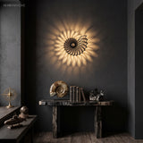 Nautilus shell wall light on a dark charcoal wall