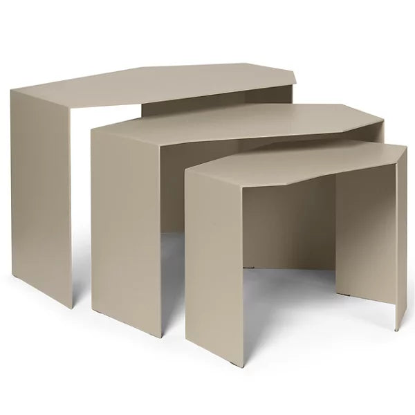 Sculptural trio of iron nesting side tables arranged in living room