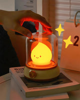 Hand cupped over the dome of the night light while it glows deep amber