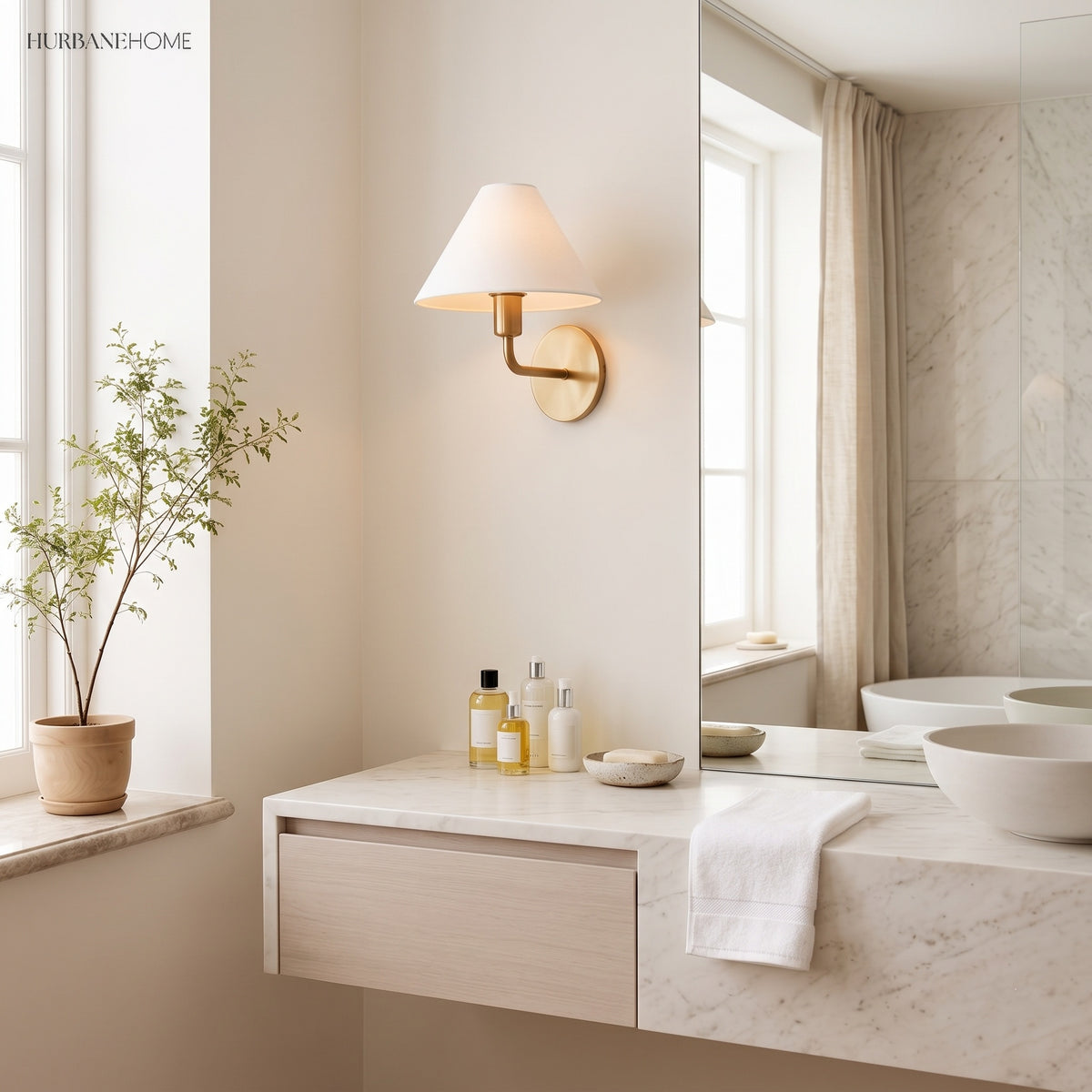 Brass cone wall sconce above a stone bathroom vanity and potted tree